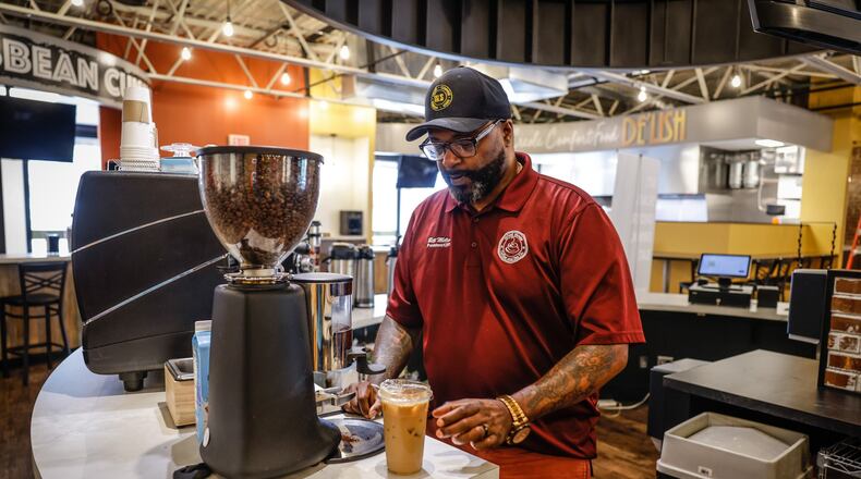 Bill Miller, owner of Miller’s Grind & Brew, makes a tall iced coffee. JIM NOELKER/STAFF