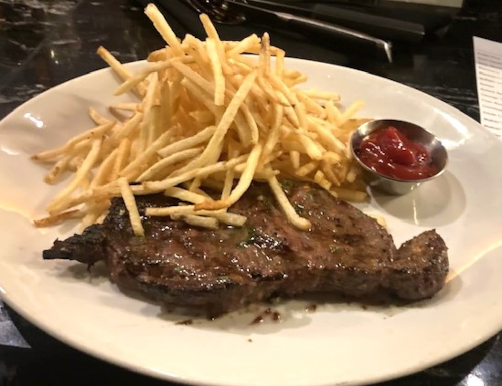 The 'Steak'N'Fries' at J. Alexander's. Shown here is a New York Strip, medium. RAY MARCANo/CONTRIBUTED