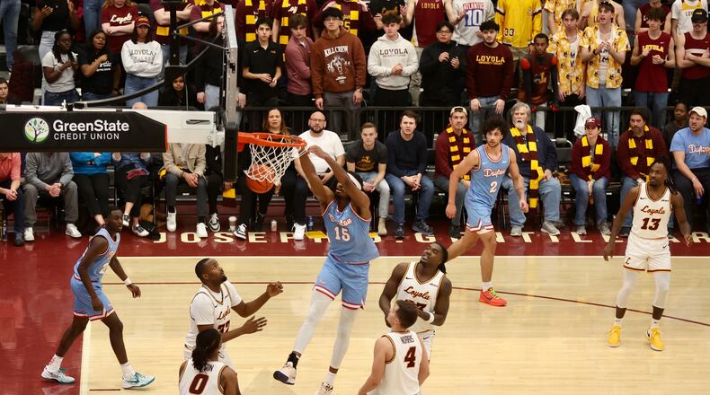 Dayton's DaRon Holmes II dunks against Loyola Chicago in the first half on Friday, March 1, 2024, at Gentile Arena in Chicago. David Jablonski/Staff