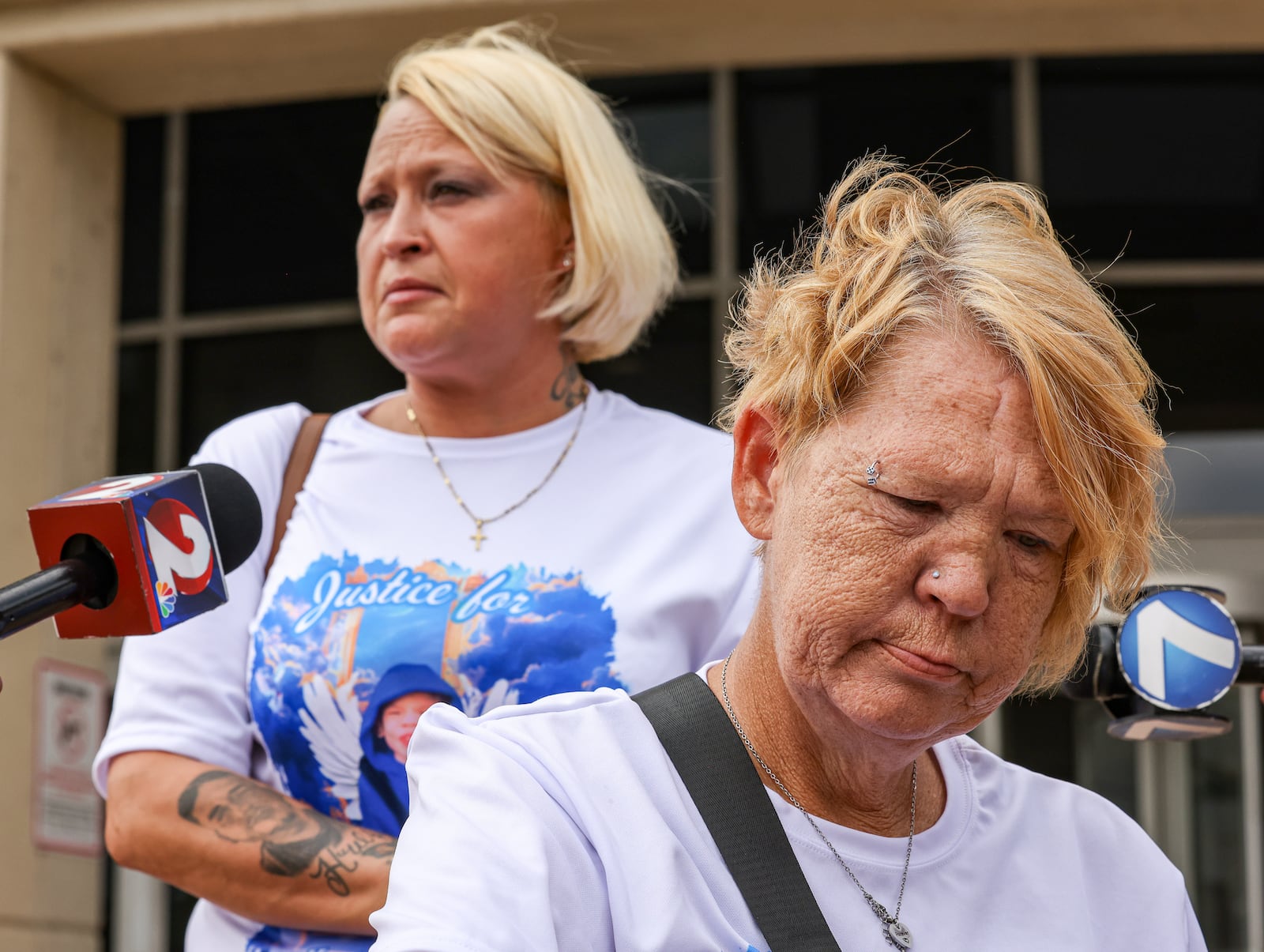 Missy Creachbaum listens as Jessica McNire speaks following an appearance in court by Michael Kendrick on Tuesday, July 15. Kendrick appeared in court and is being charged with three counts of tampering with evidence and one count of gross abuse of a corpse in relation to the death of 7-year-old Hershall Creachbaum. Missy Creachbaum is his grandmother and McNire is his aunt. BRYANT BILLING / STAFF