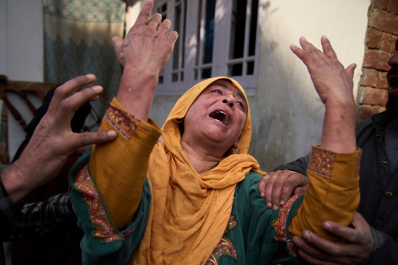 A relative of Ahsan Ul Haq Shiekh, a militant who officials say is involved in the deadly attack on tourists in Pahalgam, wails after Indian forces blew up the family home at Murran village in Pulwama, south of Srinagar, Indian controlled Kashmir, Saturday, April 26, 2025. (AP Photo/Dar Yasin)