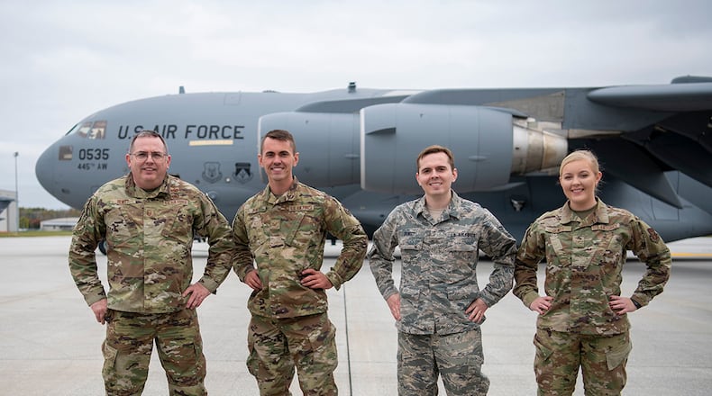 DeWitt family: Master Sgt. Raymond DeWitt Jr., 445th Maintenance Squadron; Tech. Sgt. Joshua DeWitt, 445th MXS; former Senior Airman Daniel DeWitt, 445th Force Support Squadron; and Airman 1st Class Katie DeWitt, 445th Maintenance Group, pose for a photo. U.S. AIR FORCE PHOTO/MASTER SGT. PATRICK O’REILLY