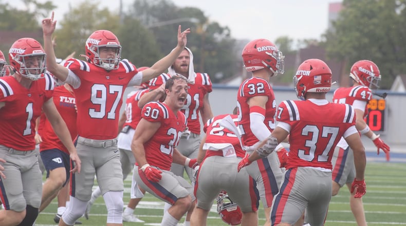 Dayton celebrates a victory against St. Francis on Saturday, Aug. 31, 2024, at Welcome Stadium in Dayton. David Jablonski/Staff