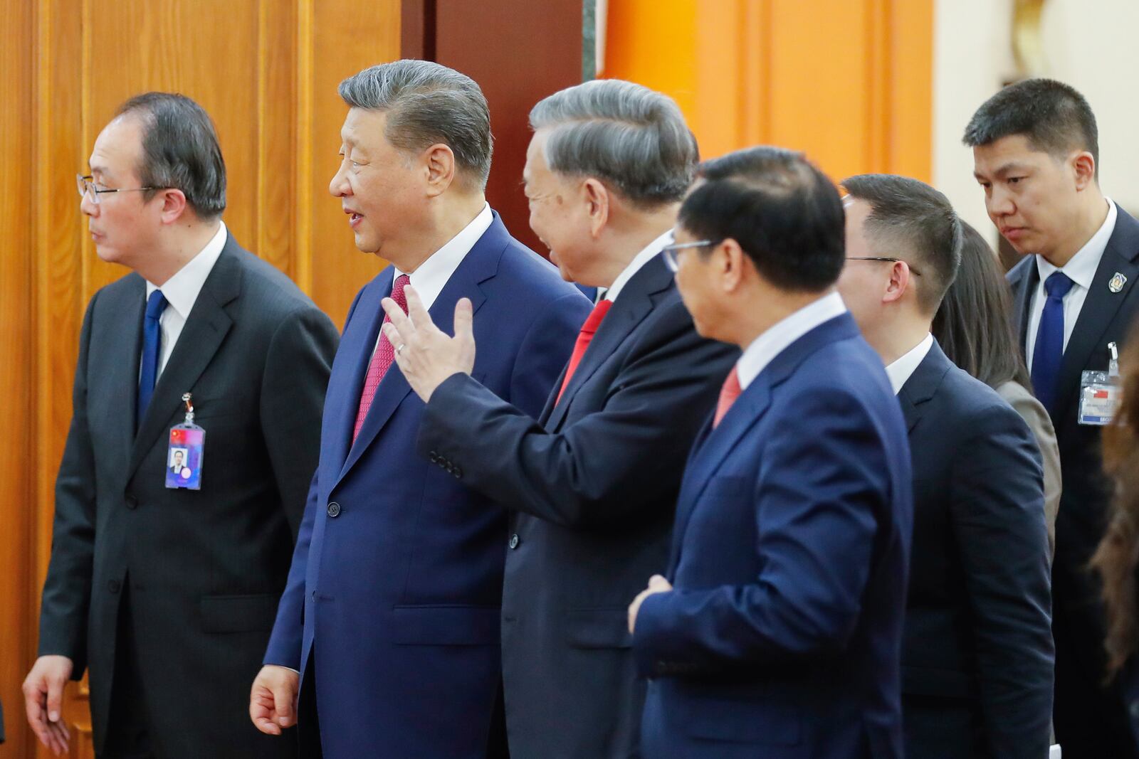 Vietnamese General Secretary of Communist Party To Lam, second right, and Chinese President Xi Jinping walk out of a meeting room at the Office of the Party Central Committee in Hanoi, Vietnam, Monday, April 14, 2025. (AP Photo/Minh Hoang, Pool)