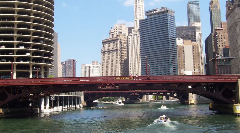 You get a bottom-up view of the Chicago skyline-with streets, sidewalks and pedestrians all above the cruise boats on the low-lying Chicago River in Chicago. (Bob Downing/Akron Beacon Journal/TNS)