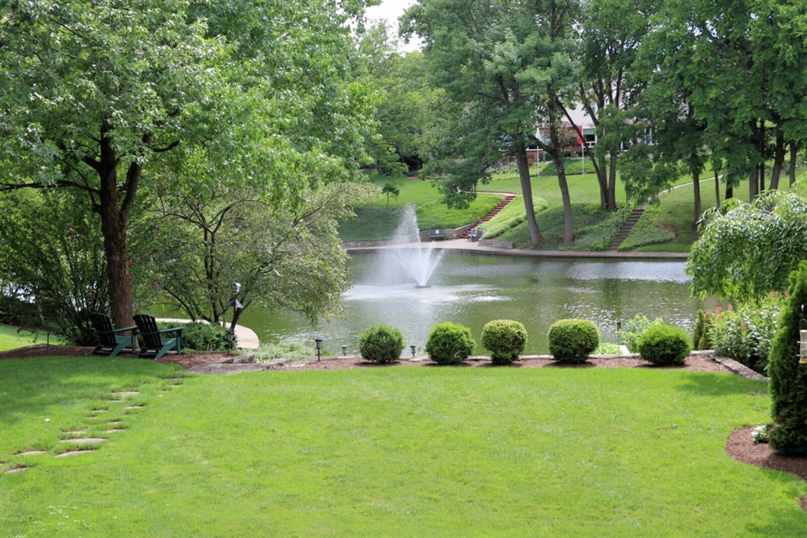 A James Hill Road, Kettering home for sale offers this view of a lake with a fountain. KATHY TYLER/CONTRIBUTED