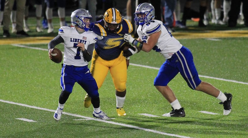 Springfield's Jokell Brown records a sack against Olentangy Liberty on Friday, Oct. 30, 2020, at Springfield. David Jablonski/Staff