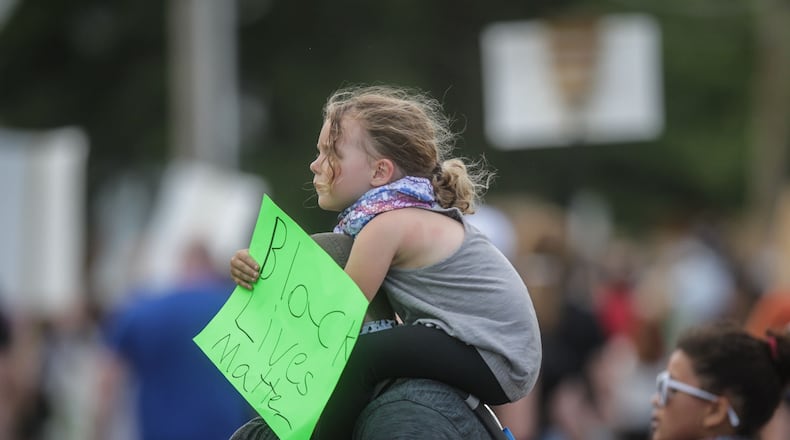 About  500 protesters marched in Kettering on  Wednesday. JIM NOELKER / STAFF