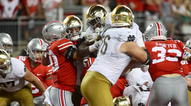 Notre Dame's Audric Estime scores a touchdown against Ohio State in the first half on Saturday, Sept. 3, 2022, at Ohio Stadium in Columbus. David Jablonski/Staff