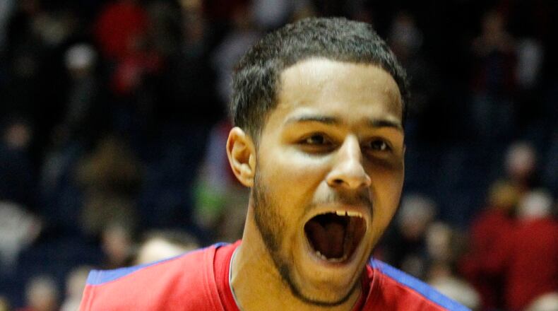 Dayton forward Devin Oliver celebrates after his game-winning 3-pointer against Ole Miss with 0.3 to play in overtime on Saturday, Jan. 4, 2014, in Oxford, Miss. David Jablonski/Staff