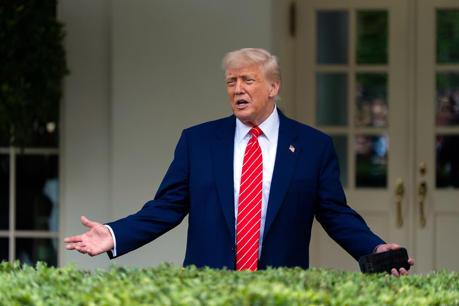 President Donald Trump speaks with reporters in front of the West Wing of the White House, Thursday, May 8, 2025, in Washington. (AP Photo/Alex Brandon)