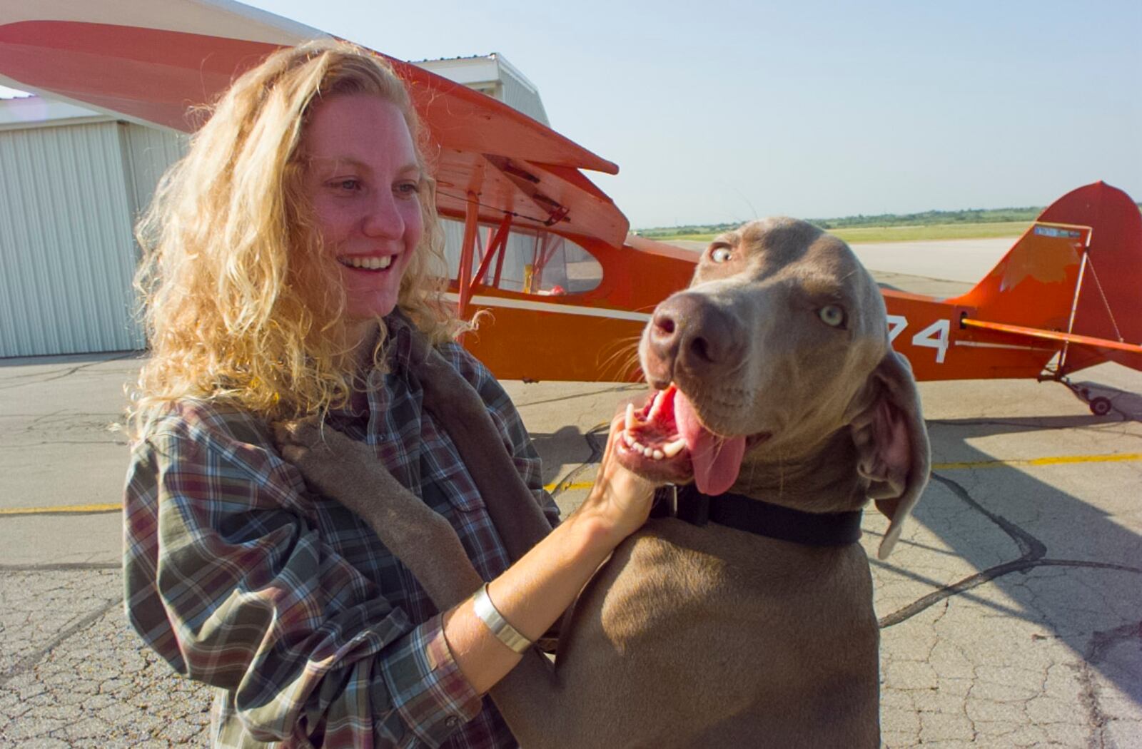 Katie Braun and her dog Harley, who loved to fly in the Piper J-3 Cub in 1997.