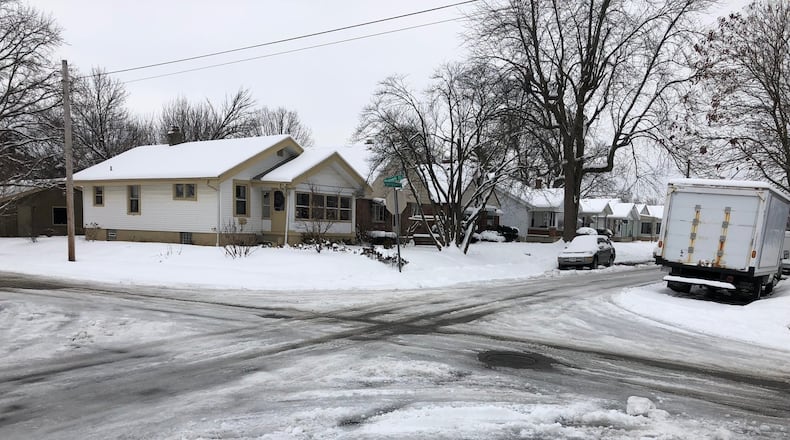 Snow and ice cover pavement at the corner of Springmont and Russell in east Dayton on Monday, Aug. 14, 2019.