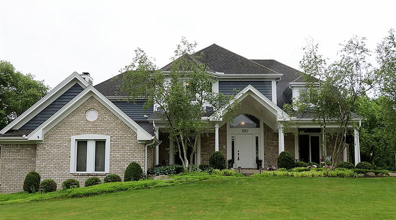 The 2-story has about 5,820 sq. ft. of living space plus a private backyard oasis. The brick home is in the Willow Brook Estates of Washington Twp., which includes walking trails and nearby parks and playgrounds. A cathedral roof peaks above the formal entry of the house as there are two sets of patio doors that open to the same front porch. CONTRIBUTED PHOTO BY KATHY TYLER