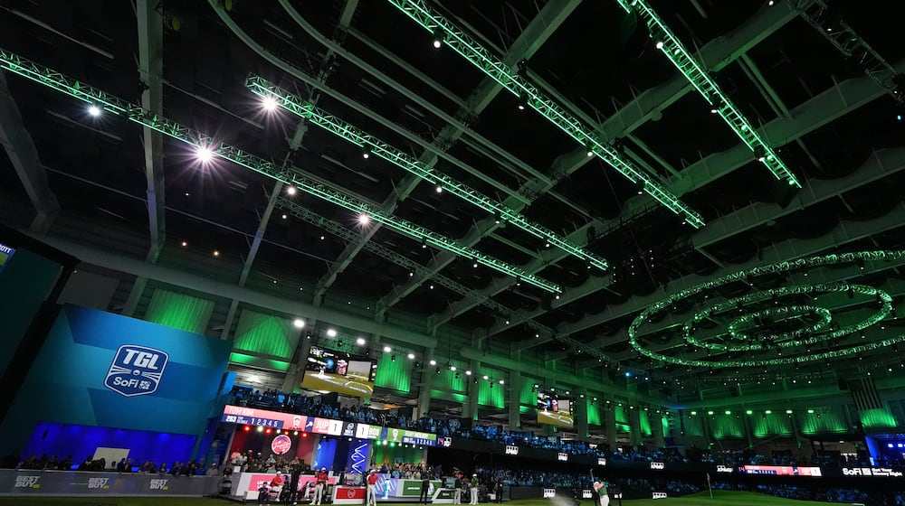 Rory McIlroy of Boston Common Golf hits out of the sand on the ninth hole during a match of the TMRW Golf League (TGL) against Jupiter Links Golf Club, Monday, Jan. 27, 2025, in Palm Beach Gardens, Fla. (AP Photo/Rebecca Blackwell)