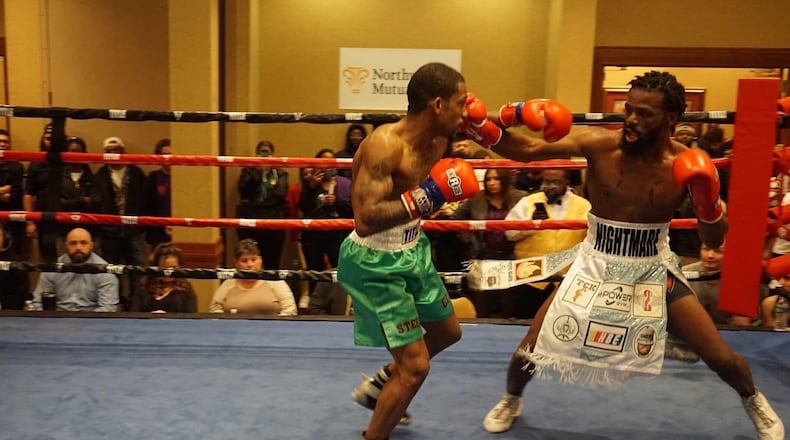 Jeff Camp lands a right hand to the jaw of Kelvin Smith in their welterweight main event at a pay per view fight show in Vienna, West Virginia on March 18. Camp won with a sixth round TKO. It was  his first bout since being shot five times and left for dead  17 months ago outside a Dollar General store he worked at on Salem Avenue.  CONTRIBUTED
