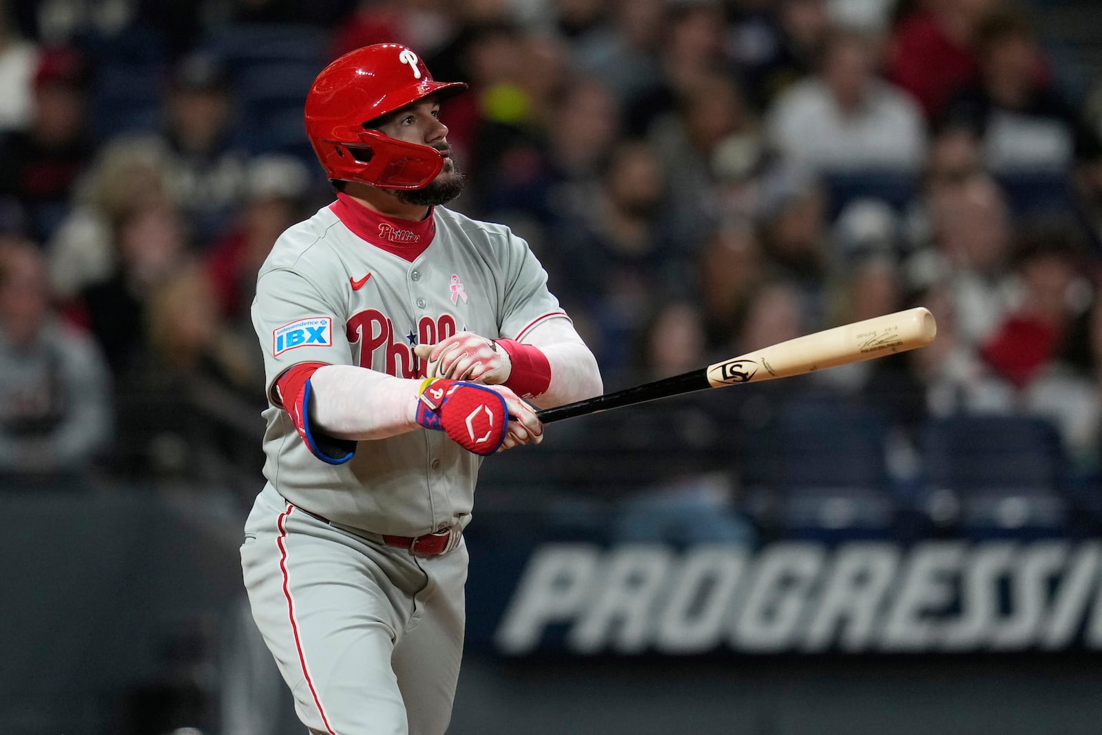 Philadelphia Phillies' Kyle Schwarber watches his home run in the eighth inning of a baseball game against the Cleveland Guardians in Cleveland, Sunday, May 11, 2025. (AP Photo/Sue Ogrocki)