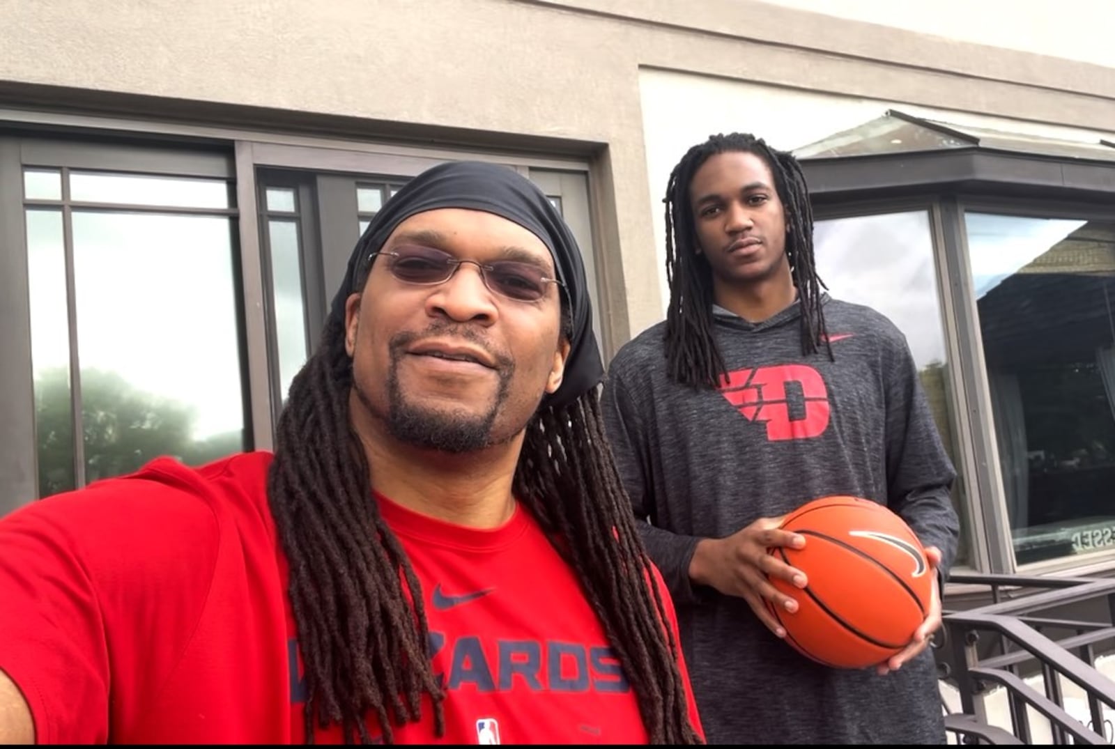 Malcolm Thomas in a UD shirt with his dad Etan doing a promo for a basketball camp they put on in Grenada, where the family has roots. CONTRIBUTED PHOTO