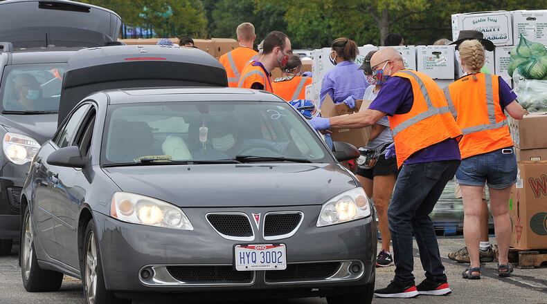 The Foodbank held it's mass food distribution Thursday, Aug. 27, 2020 at the Welcome Stadium.