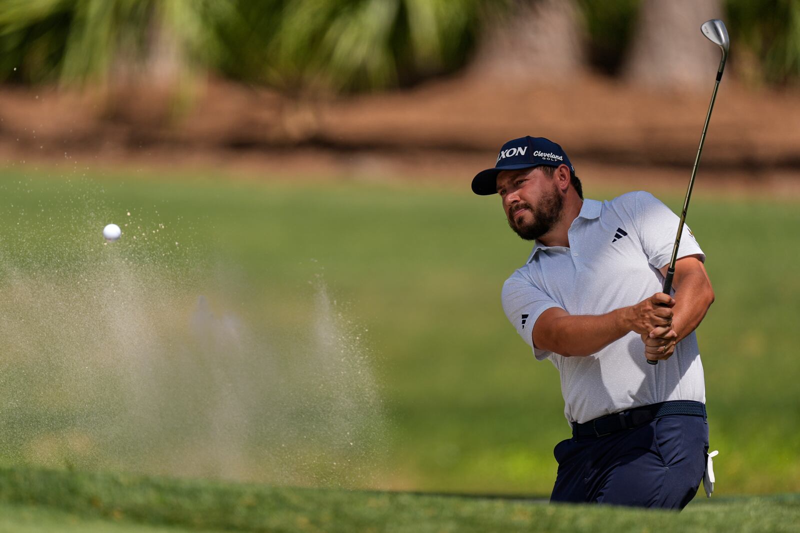 Andrew Novak hits from the bunker on the seventh hole during the final round of the RBC Heritage golf tournament, Sunday, April 20, 2025, in Hilton Head Island, S.C. (AP Photo/Mike Stewart)