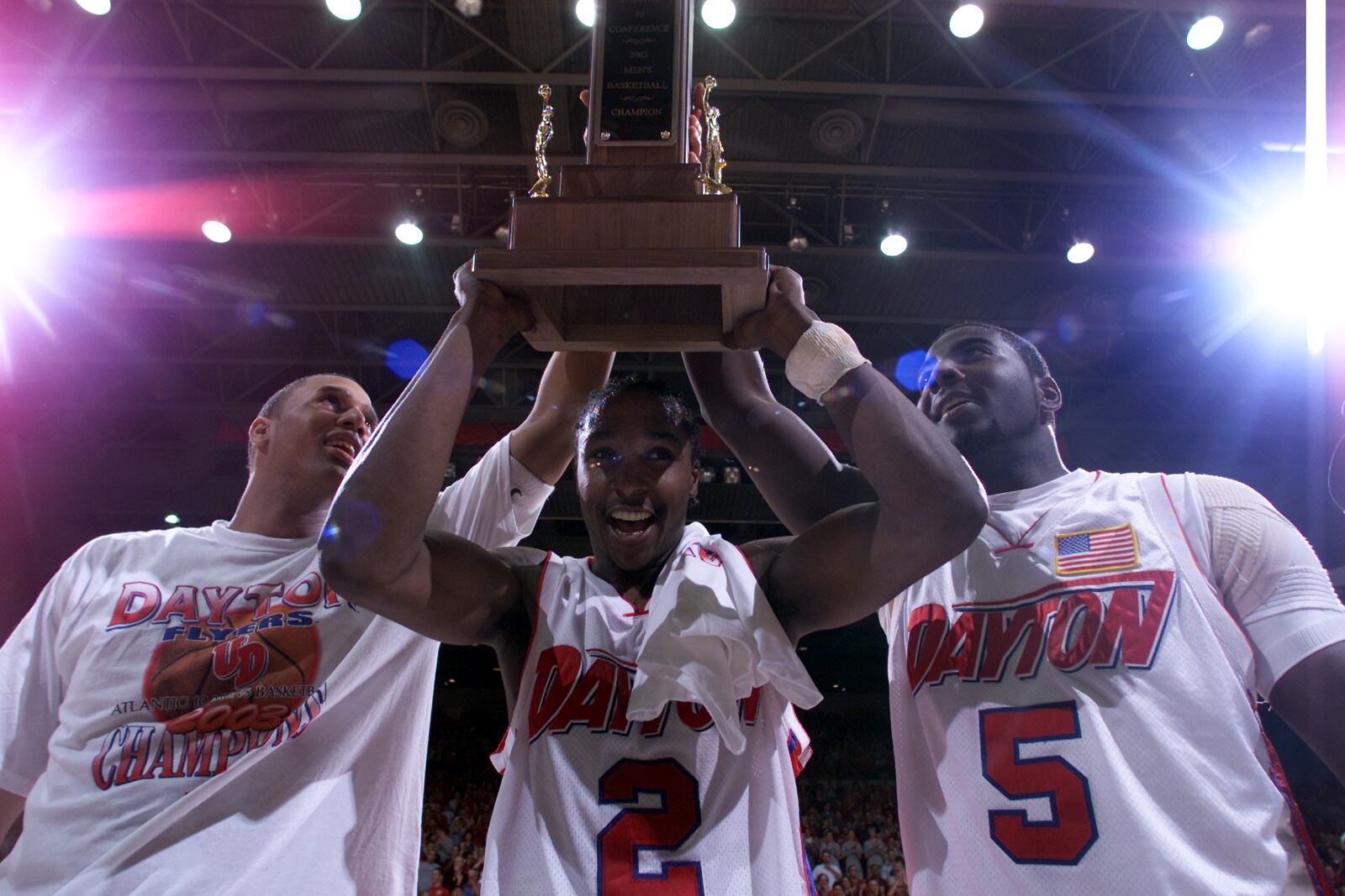 03/15/03 Dayton's Brooks Hall, D.J. Stelly, and Nate Green hold up the A-10 championship trophy after defeating Temple on Saturday afternoon.