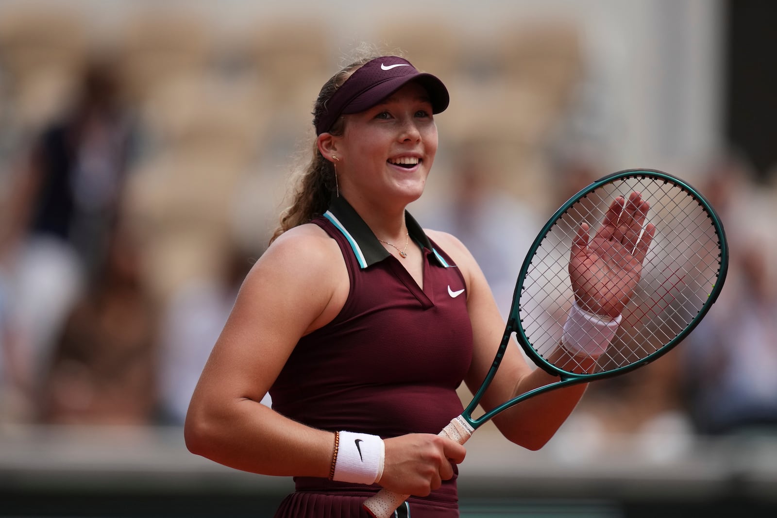 Russia's Mirra Andreeva celebrates as she won the fourth round match of the French Tennis Open against Australia's Daria Kasatkina at the Roland-Garros stadium in Paris, Monday, June 2, 2025. (AP Photo/Christophe Ena)