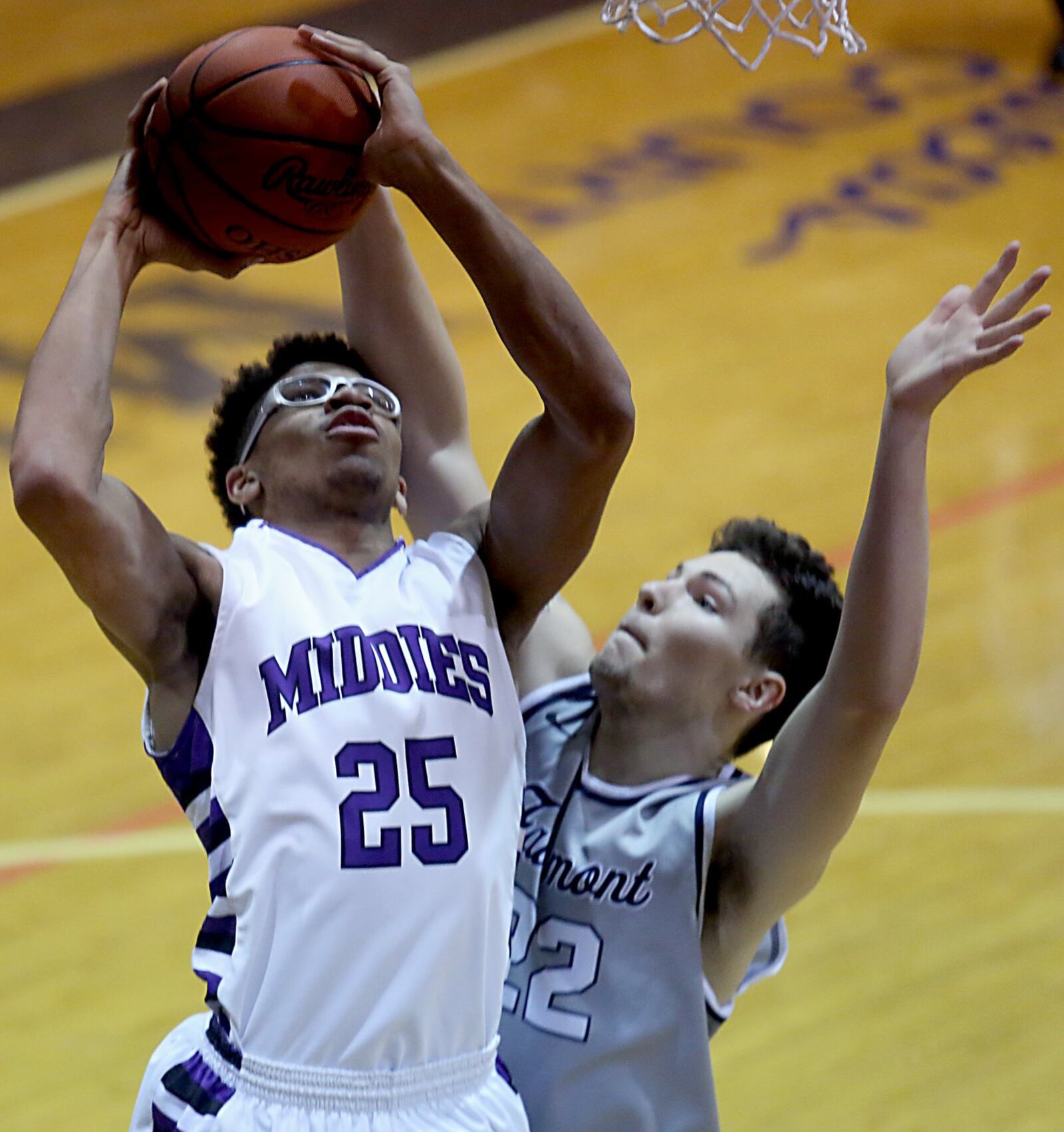 Middletown center Jawunn Bailey works inside against Fairmont center Dylan Crutchfield during their game at Wade E. Miller Gym in Middletown on Wednesday night. CONTRIBUTED PHOTO BY E.L. HUBBARD