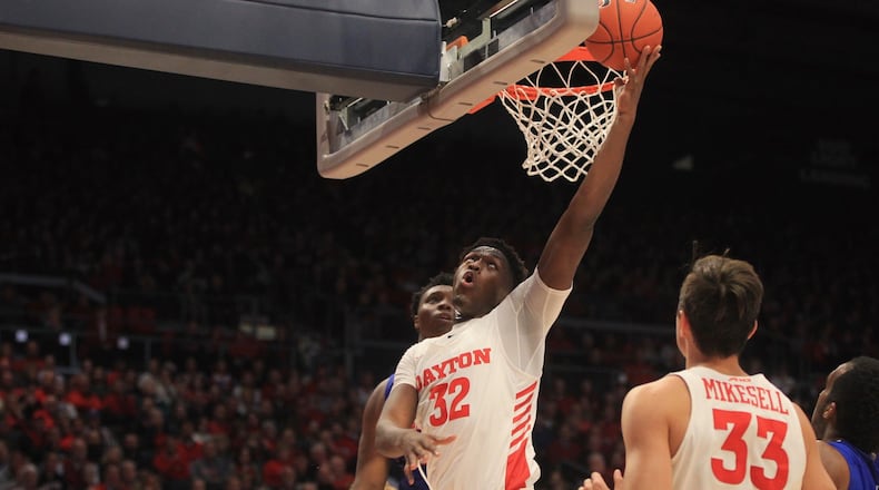 Dayton’s Jordy Tshimanga scores against Houston Baptist on Tuesday, Dec. 3, 2019, at UD Arena. David Jablonski/Staff