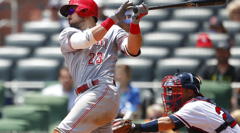 ATLANTA, GA - JUNE 27: Adam Duvall #23 of the Cincinnati Reds hits a single to bring in two runs in the seventh inning of an MLB game against the Atlanta Braves at SunTrust Park on June 27, 2018 in Atlanta, Georgia. (Photo by Todd Kirkland/Getty Images)