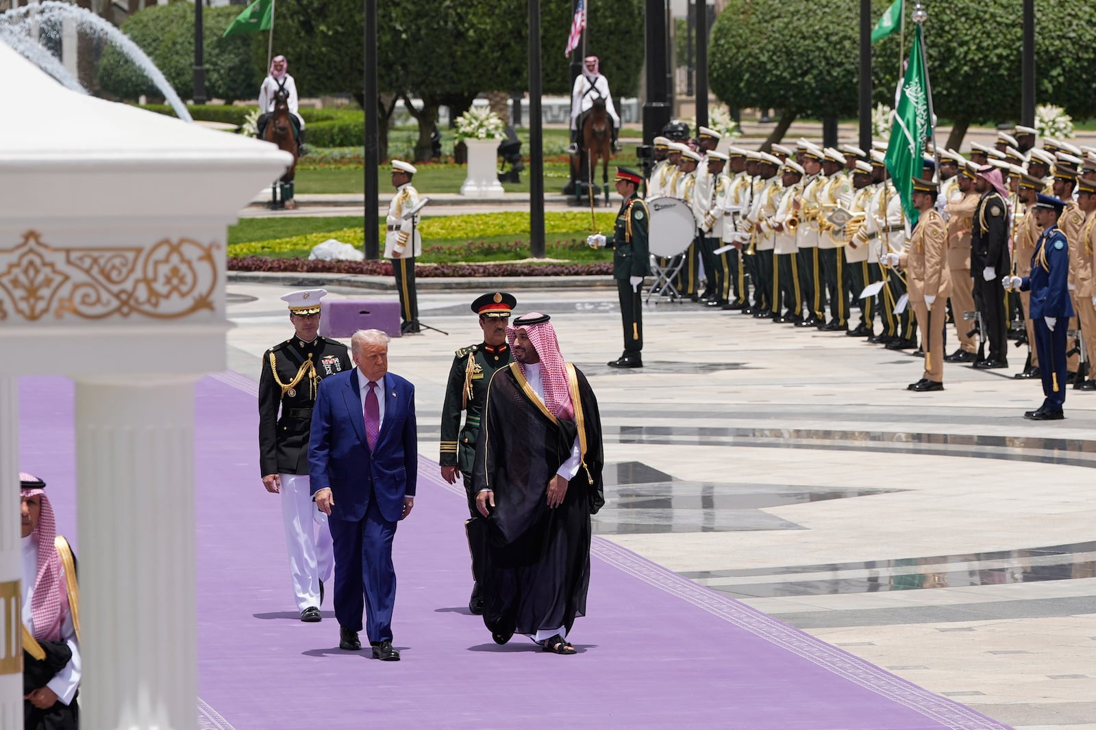 President Donald Trump and Saudi Crown Prince Mohammed bin Salman walk during an arrival ceremony at the Royal Palace in Riyadh, Saudi Arabia, Tuesday, May 13, 2025. (AP Photo/Alex Brandon)