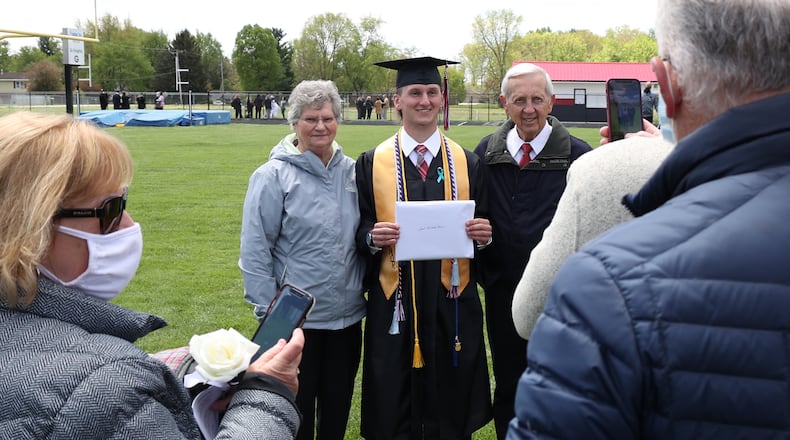 Greenon High School held their 2021 Commencement Ceremony Saturday. Over a 100 graduates, sitting six feet apart and all wearing masks, participated in the ceremony at the school's statium. Greenon is the fist school in the area to hold a 2021 commencement ceremony. BILL LACKEY/STAFF