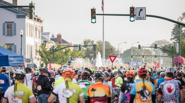 Participants in the 2017 Tour de Donut fill the Troy Public Square during the event’s first year in Troy. The bicycle event previously was held in Darke County. Contributed photo.