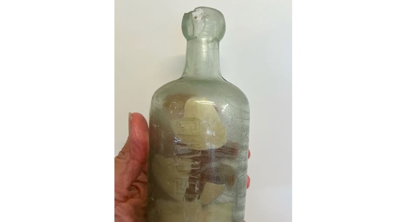 This photo provided by Deb Brown shows a bottle with letters inside in Condingup, Australia, Saturday, Oct. 25, 2025. (Deb Brown via AP)