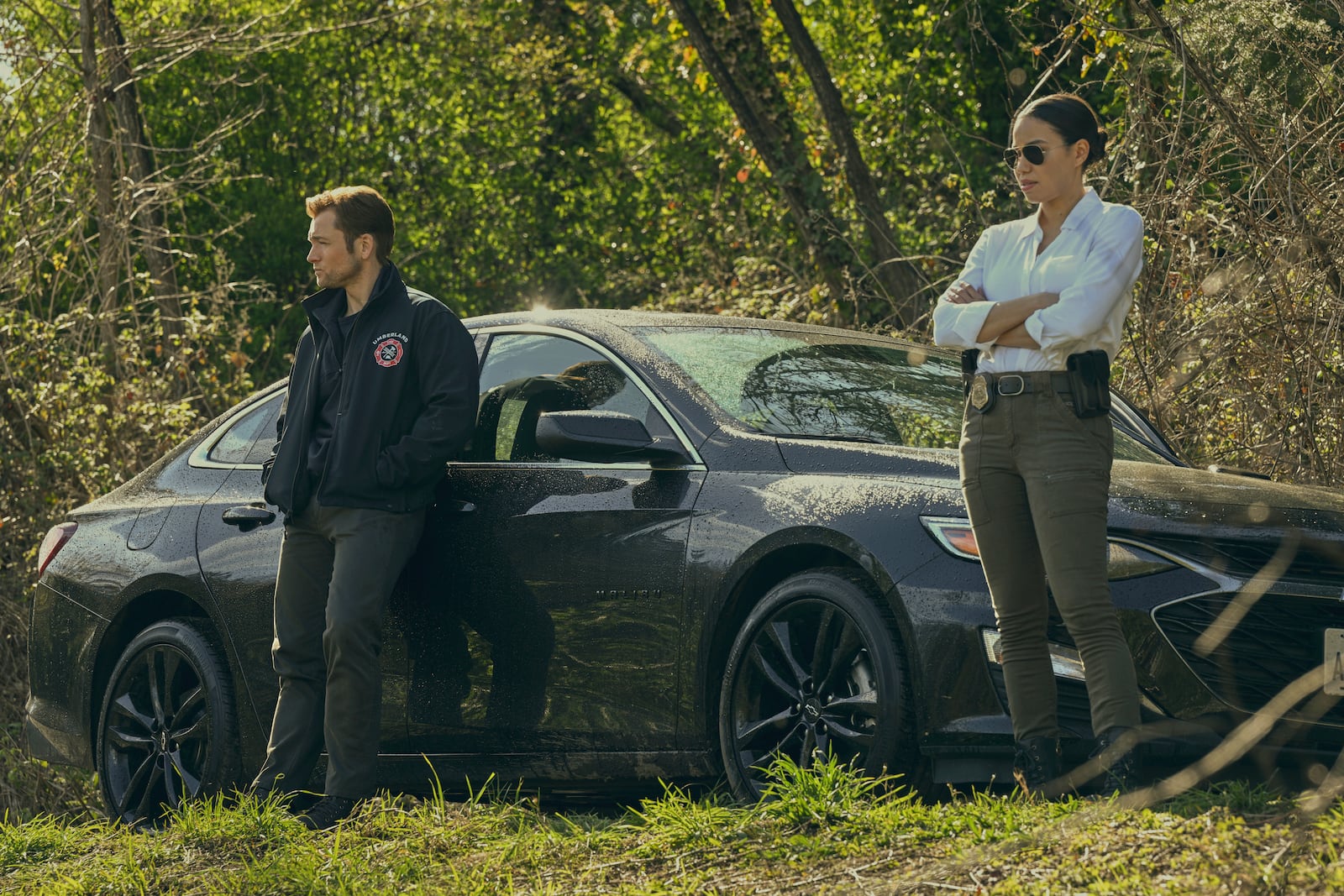 This image released by Apple TV+ shows Taron Egerton, left, and Jurnee Smollett in a scene from "Smoke." (Apple TV+ via AP)