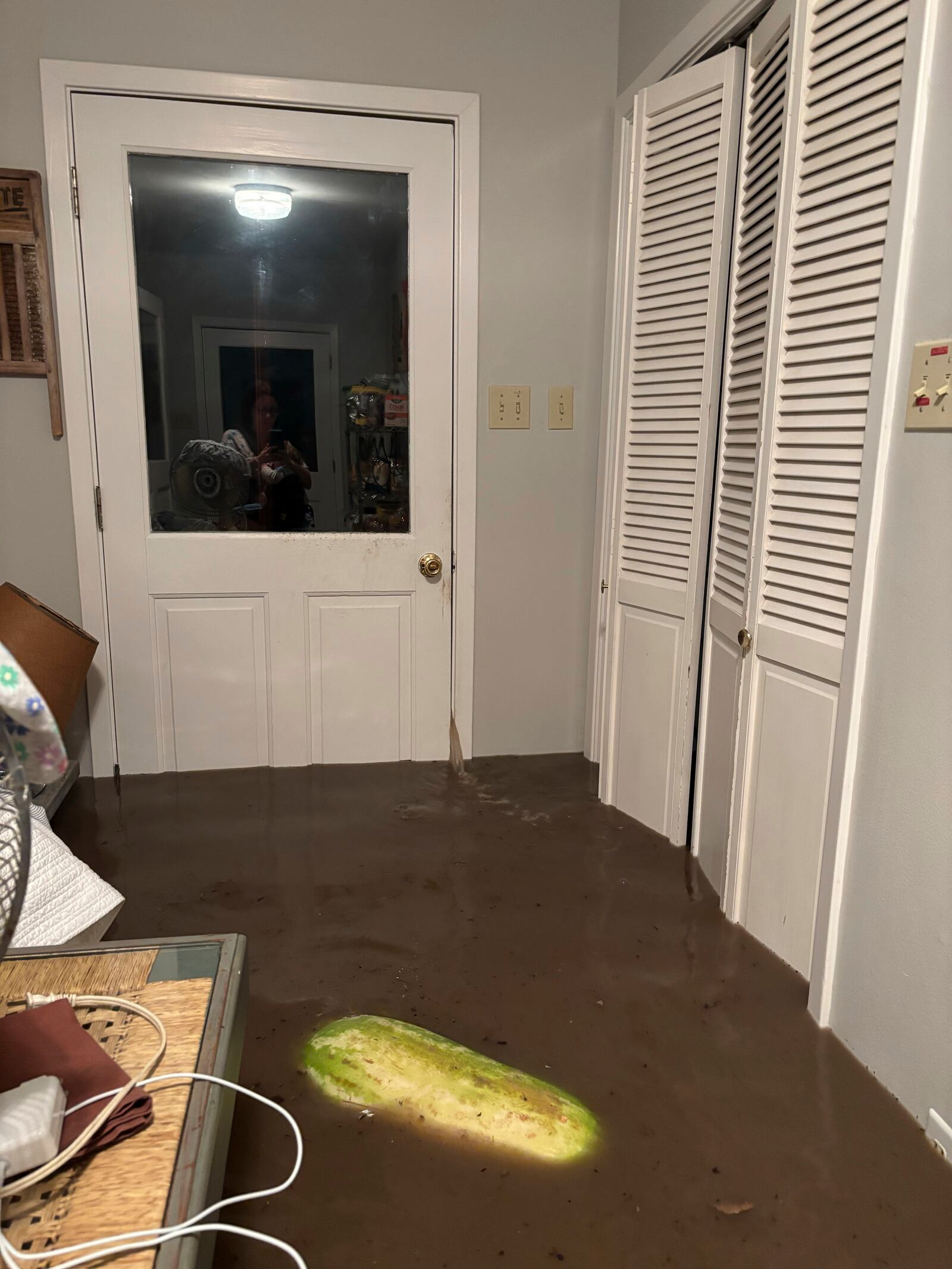 Water leaks through a door jamb in Alden Towler's cabin in Hunt, Texas, at 4:15 a.m. on Friday, July 4, 2025. (Shabd Simon-Alexander via AP)