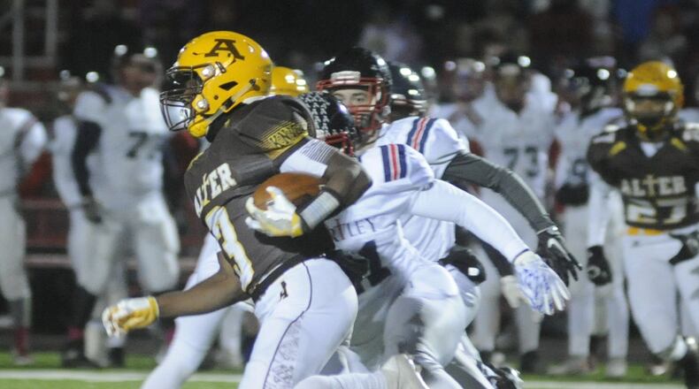 Alter’s John Bivens returns a first-half kickoff 59 yards to set up a score. Columbus Bishop Hartley defeated Alter 14-7 in a D-IV high school football state semifinal game at London on Friday, Nov. 25, 2016. MARC PENDLETON / STAFF