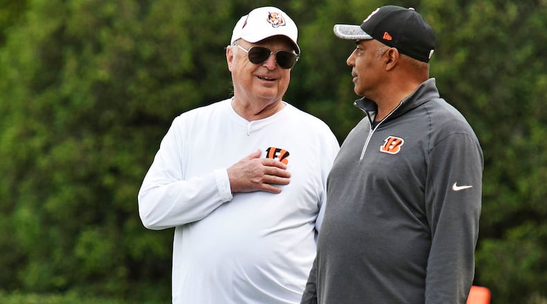 Head coach Marvin Lewis, right, and owner Mike Brown stand on the sideline during rookie camp for the Cincinnati Bengals Friday, May 6 at the practice fields next to Paul Brown Stadium in Cincinnati. NICK GRAHAM/STAFF