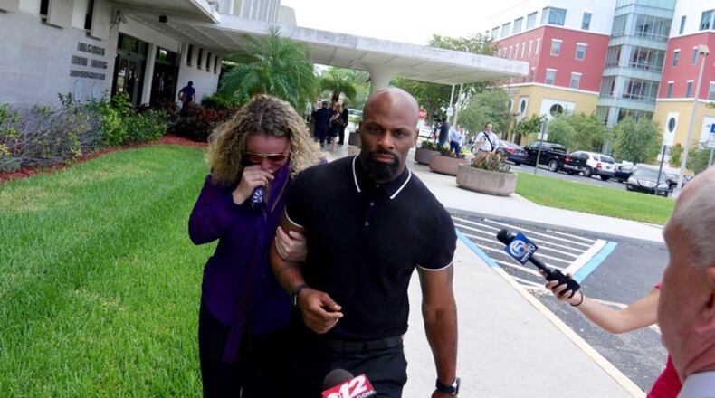 Laura Chatman walks out of the federal courthouse with family after sentencing with her husband Kenny Chatman in West Palm Beach on May 17, 2017. (Richard Graulich / The Palm Beach Post)
