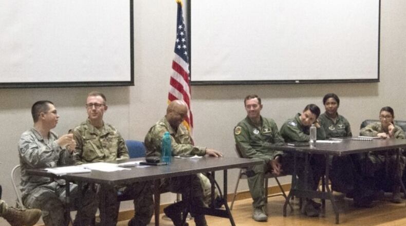 The 56th Air and Space Communications Squadron debates against the 65th Airlift Squadron about the elimination of WAPS Testing during Joint Base Pearl Harbor-Hickam’s first-ever Oxford-style debate Feb. 29 at the Hollister Auditorium. After 30 minutes, the 65th AS, who was in favor of eliminating WAPS Testing, was crowned victorious. (U.S. Air Force photo by 2nd Lt. Benjamin Aronson)