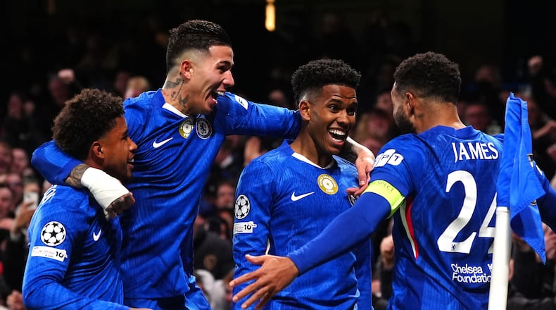 Chelsea's Estevao, second right, celebrates with his teammates after scoring his side's second goal during the Champions League opening phase soccer match between Chelsea and Barcelona in London, England, Tuesday, Nov. 25, 2025. (Bradley Collyer/PA via AP)
