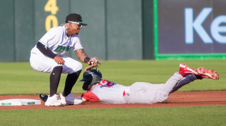 Fort Wayne's Brandon Butterworth steals second base ahead of the tag by shortstop Victor Acosta on Saturday night at Day Air Ballpark. Jeff Gilbert/CONTRIBUTED