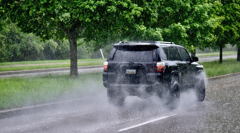 Heavy rains hit the area Monday, including this image taken near Carillon Park on Patterson. NICHOLAS GRAHAM/STAFF