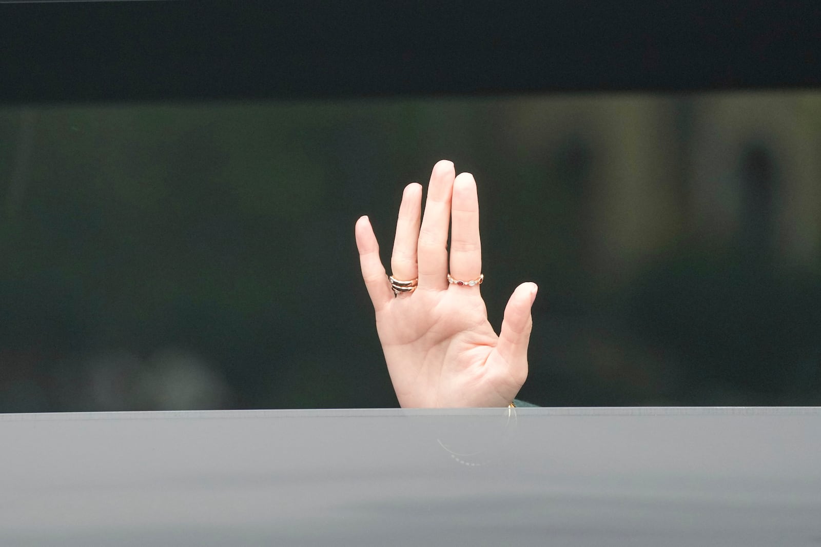 Thailand's Prime Minister Paetongtarn Shinawatra waves as she leaves Government House in Bangkok, Thailand, Tuesday, July 1, 2025, after Thailand's Constitutional Court suspended the prime minister from office pending an investigation over a leaked phone call with a former Cambodian leader. (AP Photo/Sakchai Lalit)