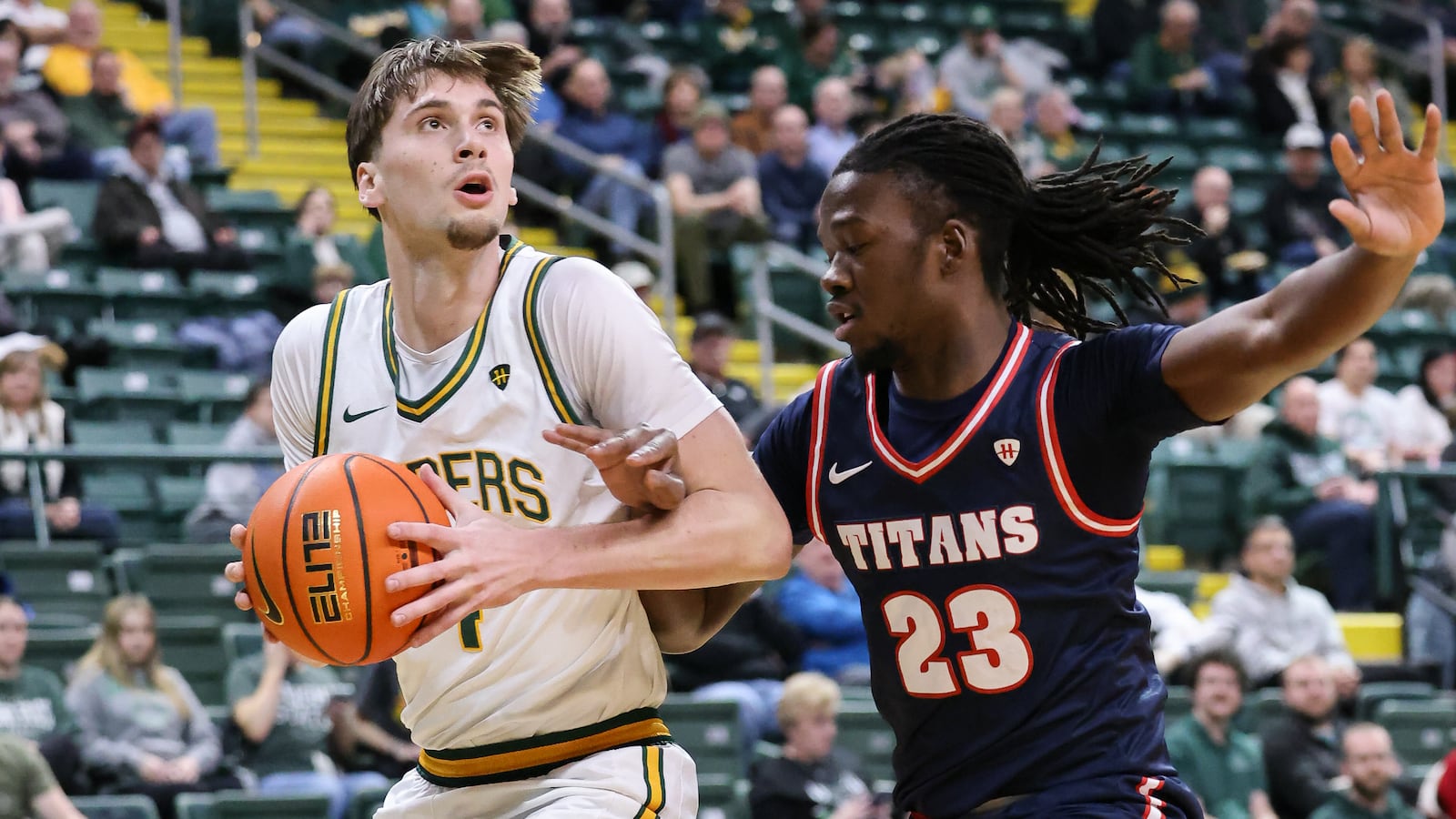 Wright State freshman forward Kellen Pickett dribbles with pressure from Detroit Mercy's Legend Geeter during a Horizon League game on Thursday, Feb. 12 at Ervin J. Nutter Center in Fairborn. BRYANT BILLING / STAFF