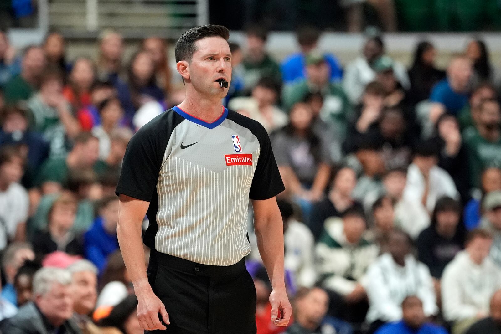 FILE - Referee Ben Taylor observes during the first half of an NBA preseason basketball game between the Detroit Pistons and the Phoenix Suns, Tuesday, Oct. 8, 2024, in East Lansing, Mich. (AP Photo/Carlos Osorio,File)