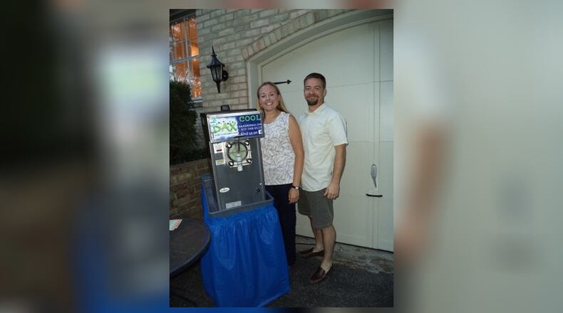 Oakwood residents Katherine and Jason Cezeaux come from Texas, where it was common to see a drink machine at parties. CONTRIBUTED