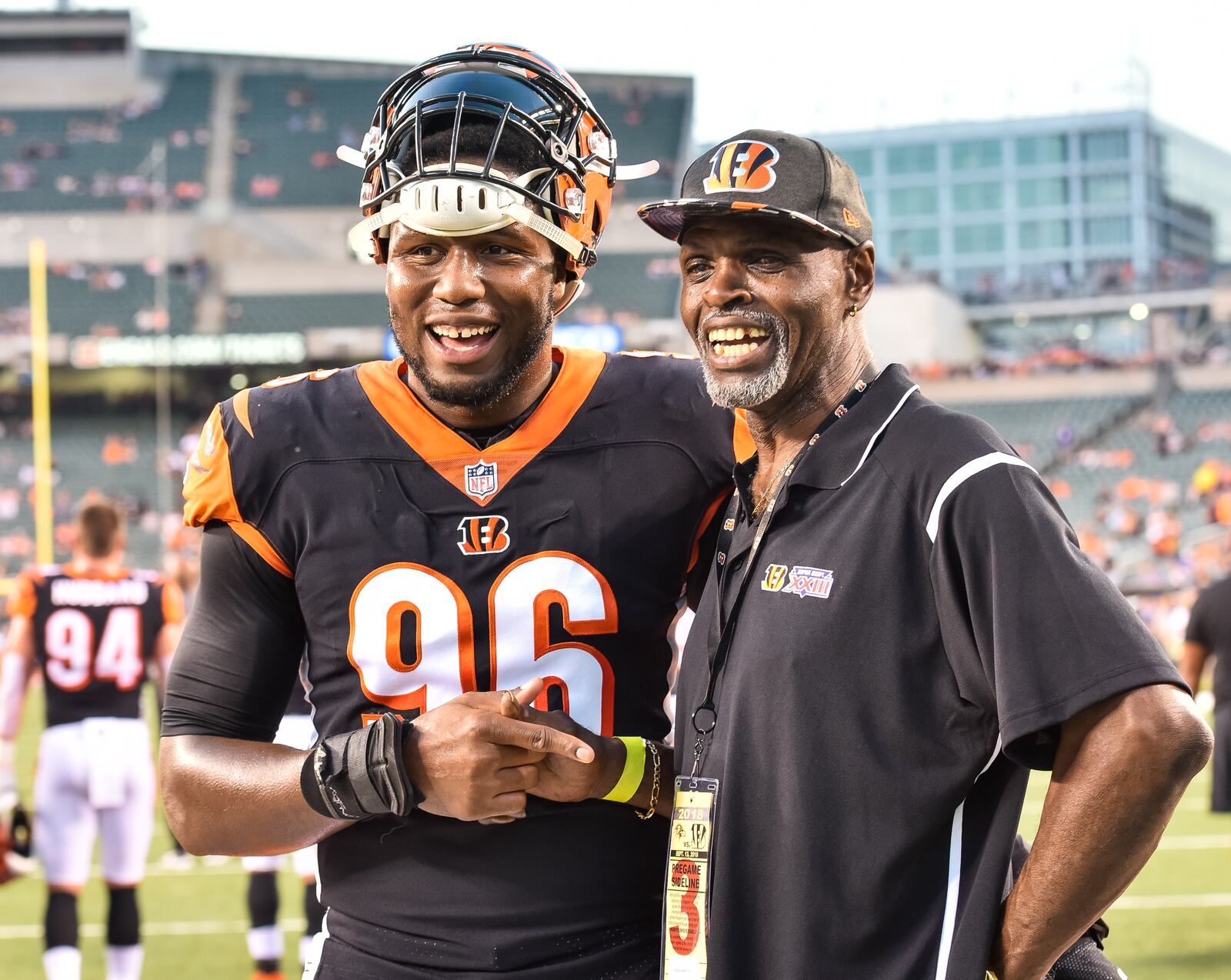 Cincinnati Bengals defensive end Carlos Dunlap gets his picture taken with former Bengal defensive end Eddie Edwards before their game against the Ravens Thursday, Sept. 13 at Paul Brown Stadium in Cincinnati. The Cincinnati Bengals defeated the Baltimore Ravens 34-23. NICK GRAHAM/STAFF