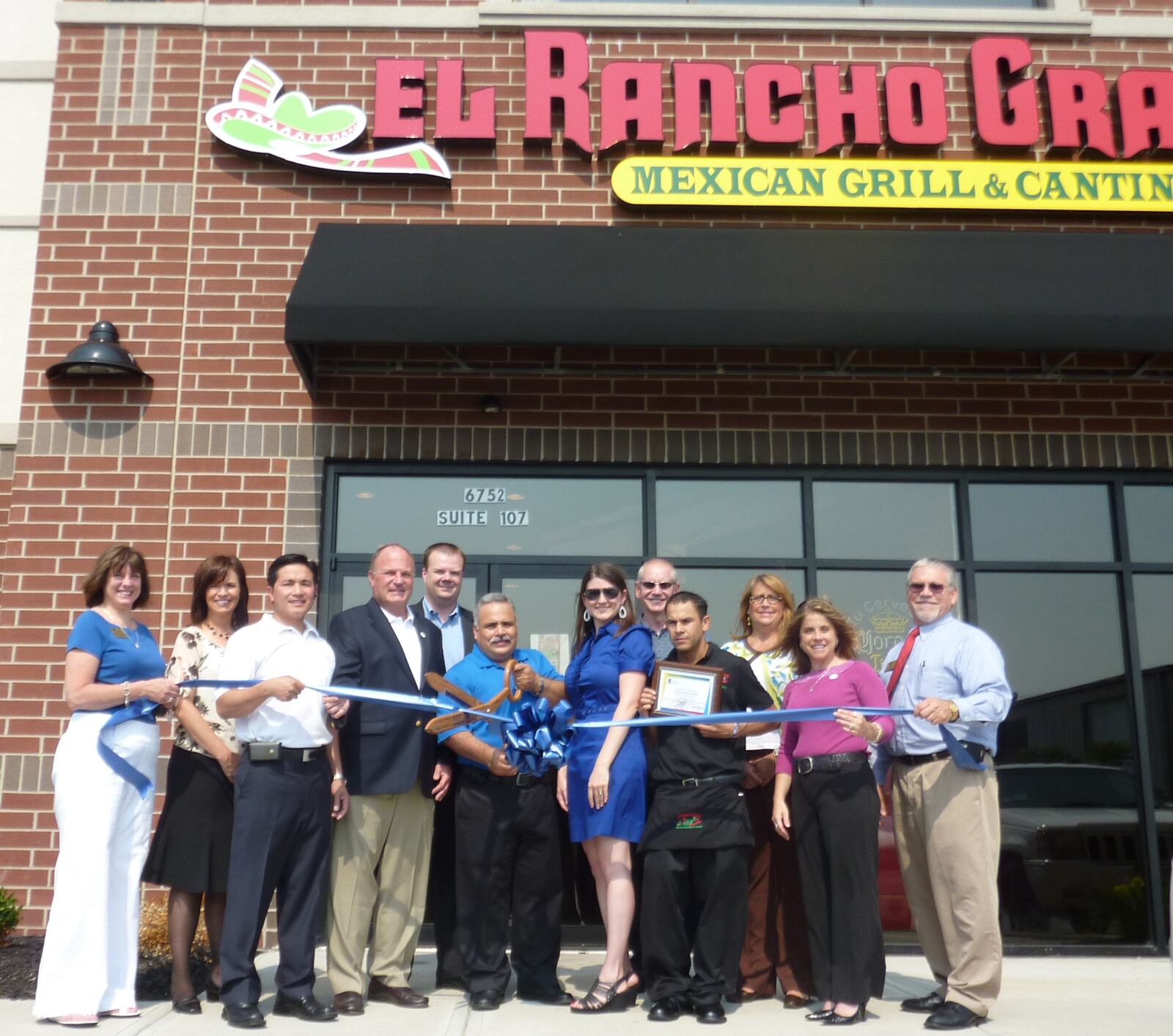 In this contributed file photo from 2010, Gary Rodriguez (center, holding scissors), president of operations of El Rancho Grande, celebrates the grand opening of El Rancho Grande in Liberty Twp. with members of the West Chester-Liberty Chamber Alliance.