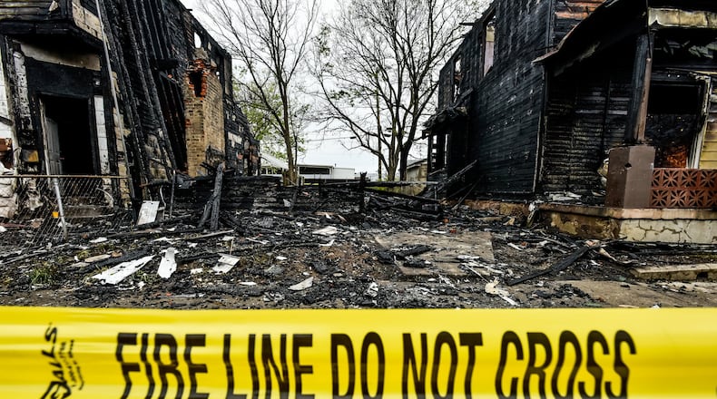 An early morning fire destroyed three homes in the 600 block of Ludlow street Wednesday, May 6, 2020 in Hamilton. NICK GRAHAM / STAFF