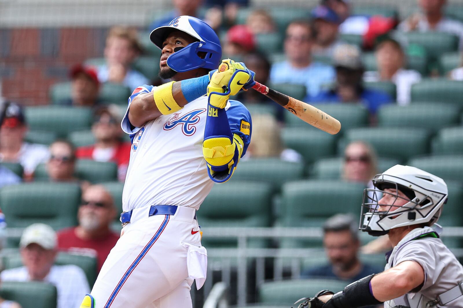 Atlanta Braves' Ronald Acuña Jr. hits a two-run home run in the second inning of a baseball game against the Colorado Rockies, Saturday, June 14, 2025, in Atlanta. (AP Photo/Colin Hubbard)